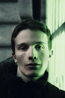 3D rendered close-up of a woman’s face with a trendy short haircut.