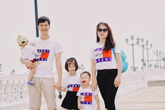 family standing outdoor during daytime