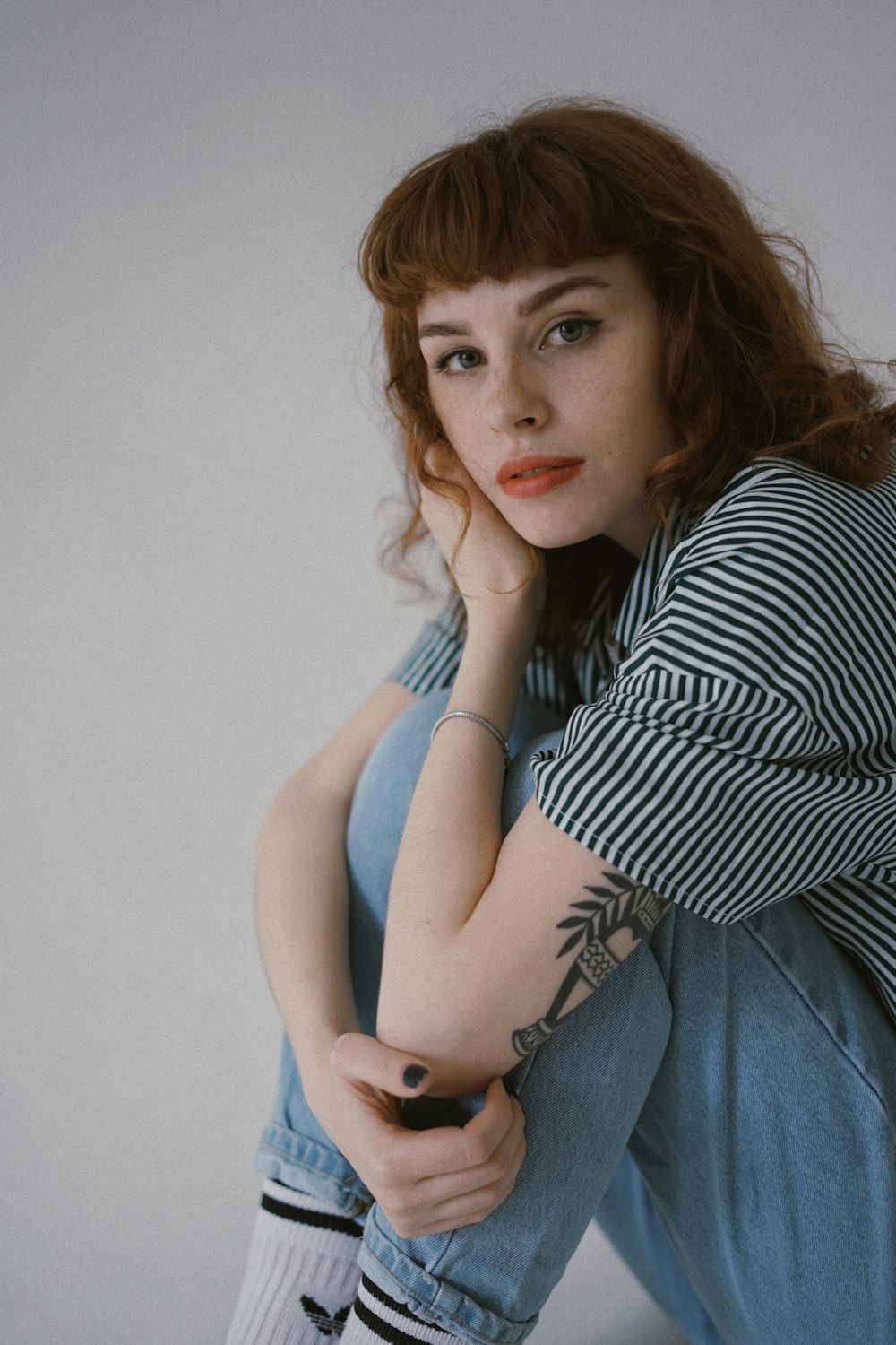 woman sitting on floor