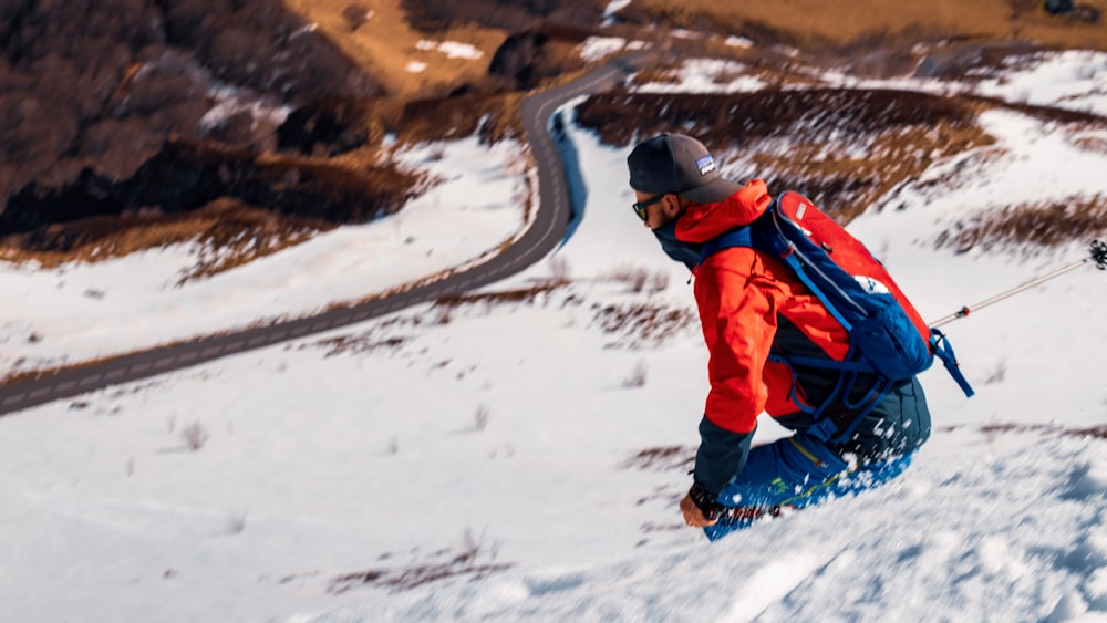 man on snowboard during daytime