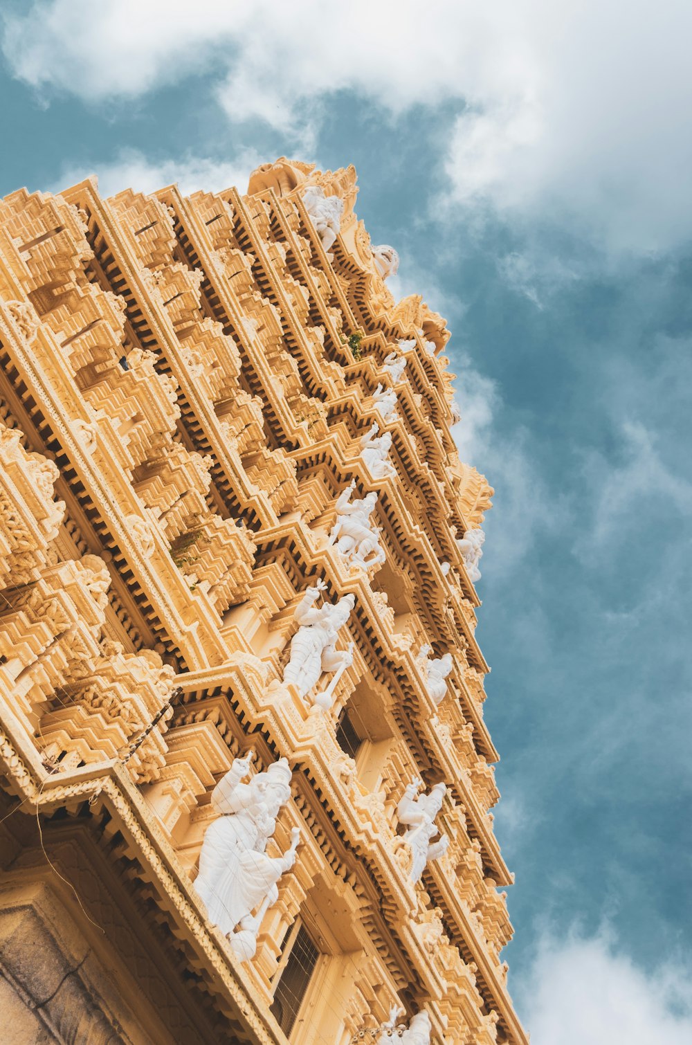 brown and white concrete building during daytime low-angle photography