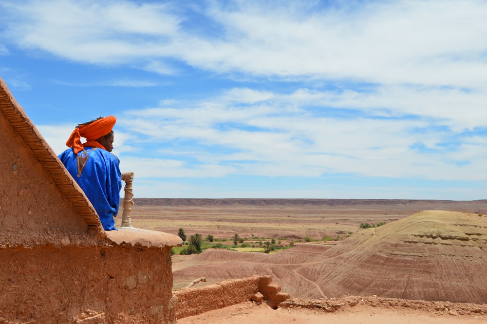 unknown person sitting outdoors