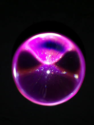 3D glowing pink wellness orb floating above a smooth glass surface with soft shadows and neon pink highlights