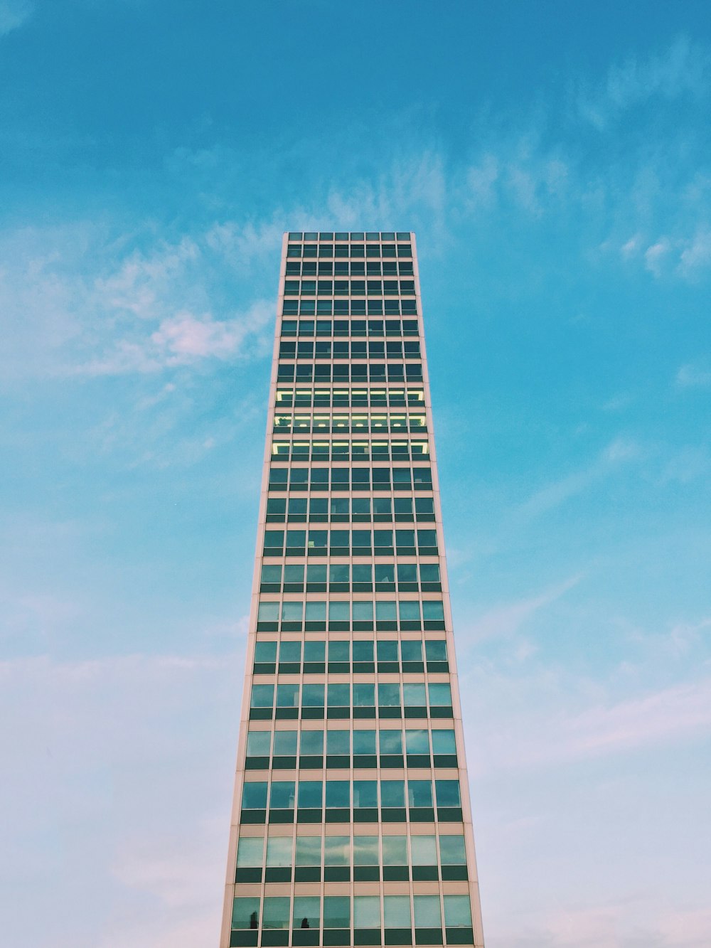 low angle photography of glass high-rise building