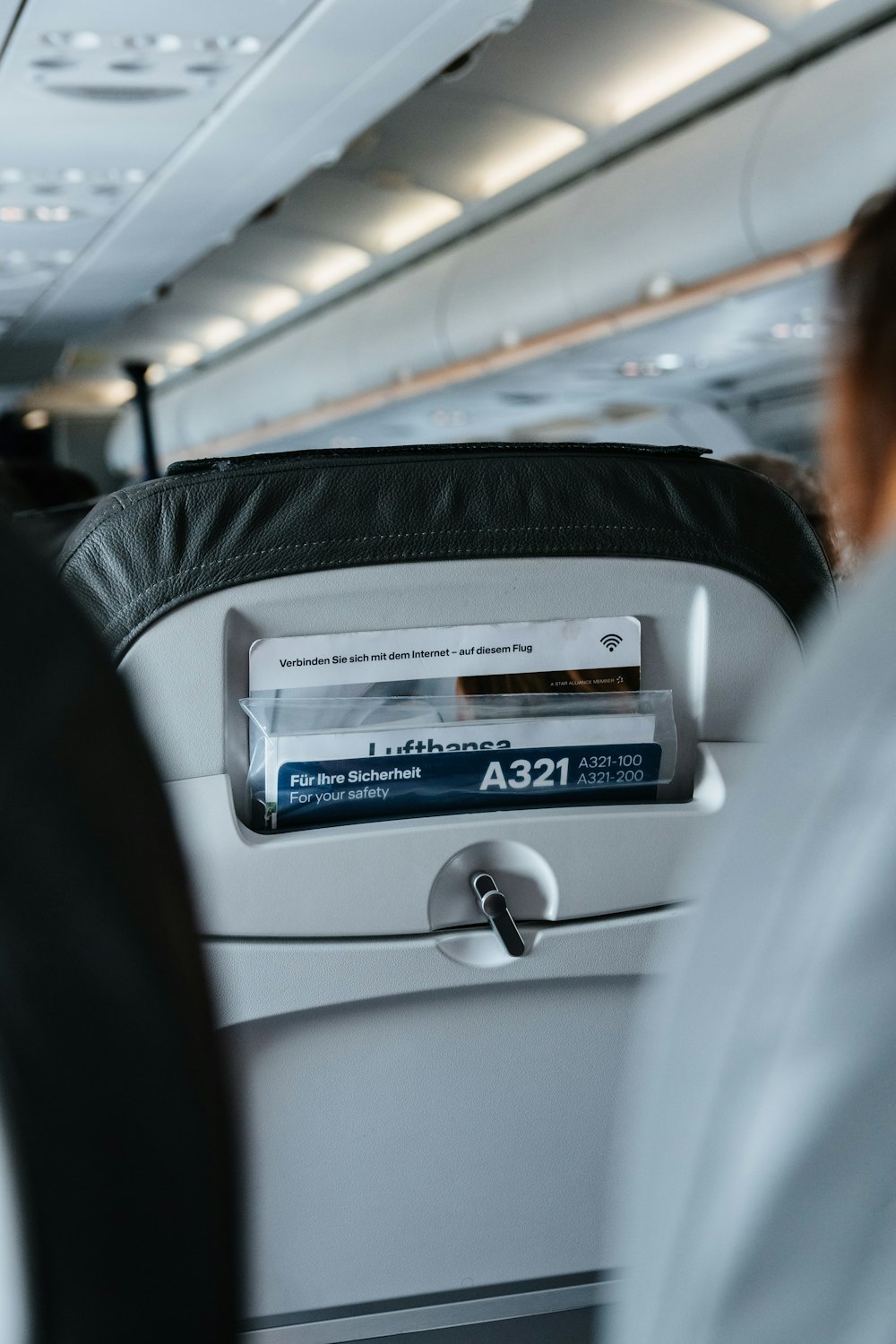 person sitting inside airplane