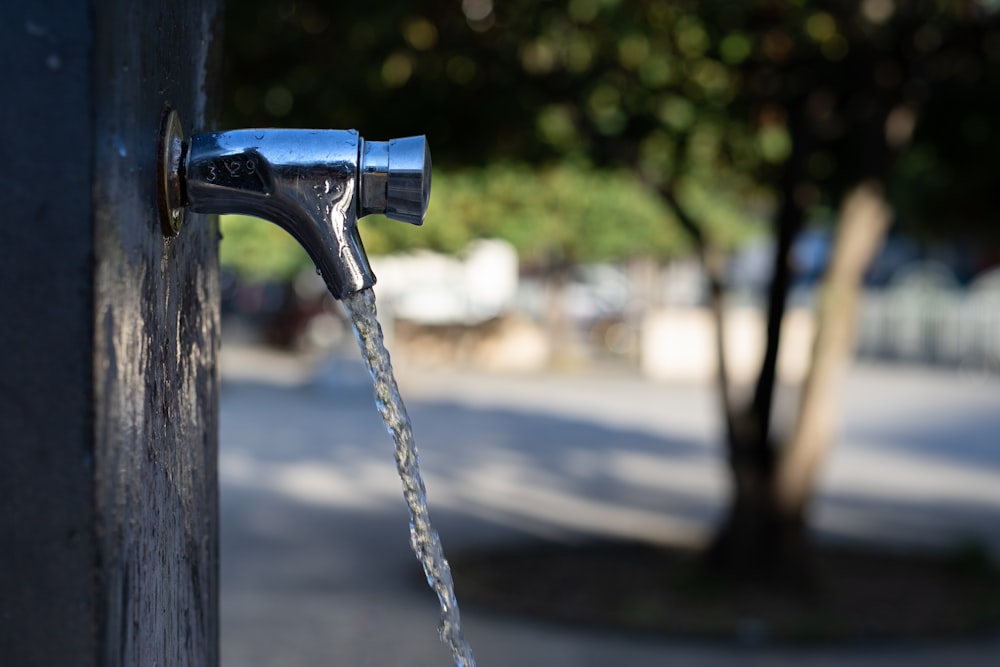 gray stainless steel faucet during daytime close-up photography