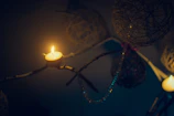 Warm candlelit space decorated with subtle sparks of golden light.