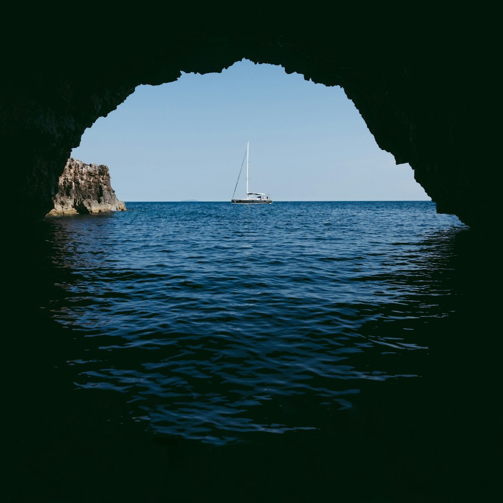 cave in the ocean viewing boat at distance