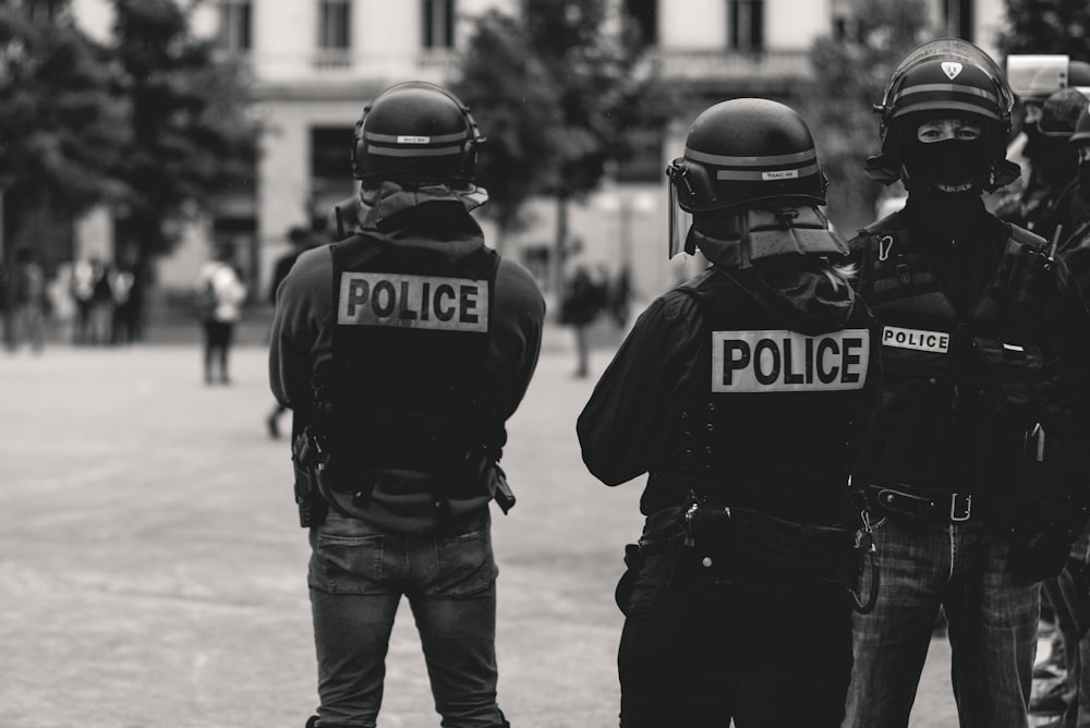 group of police grayscale photo