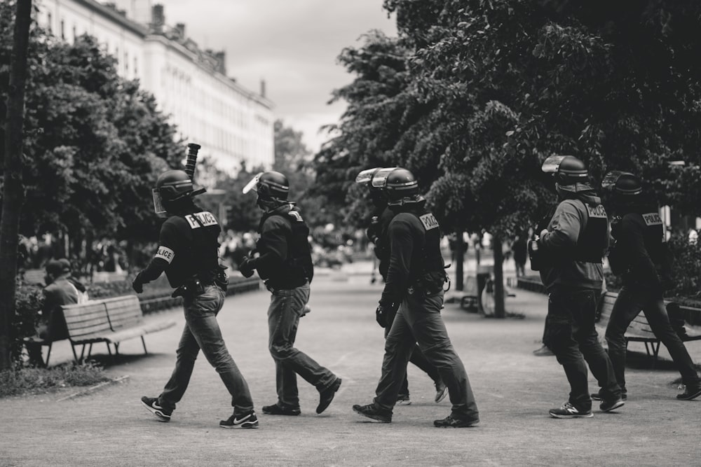 policemen walking on park