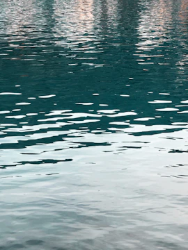Calm meditation space with soft teal and aqua tones reflecting mental wellness.