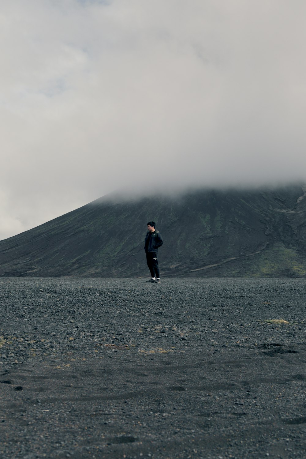 person standing near mountain during daytime