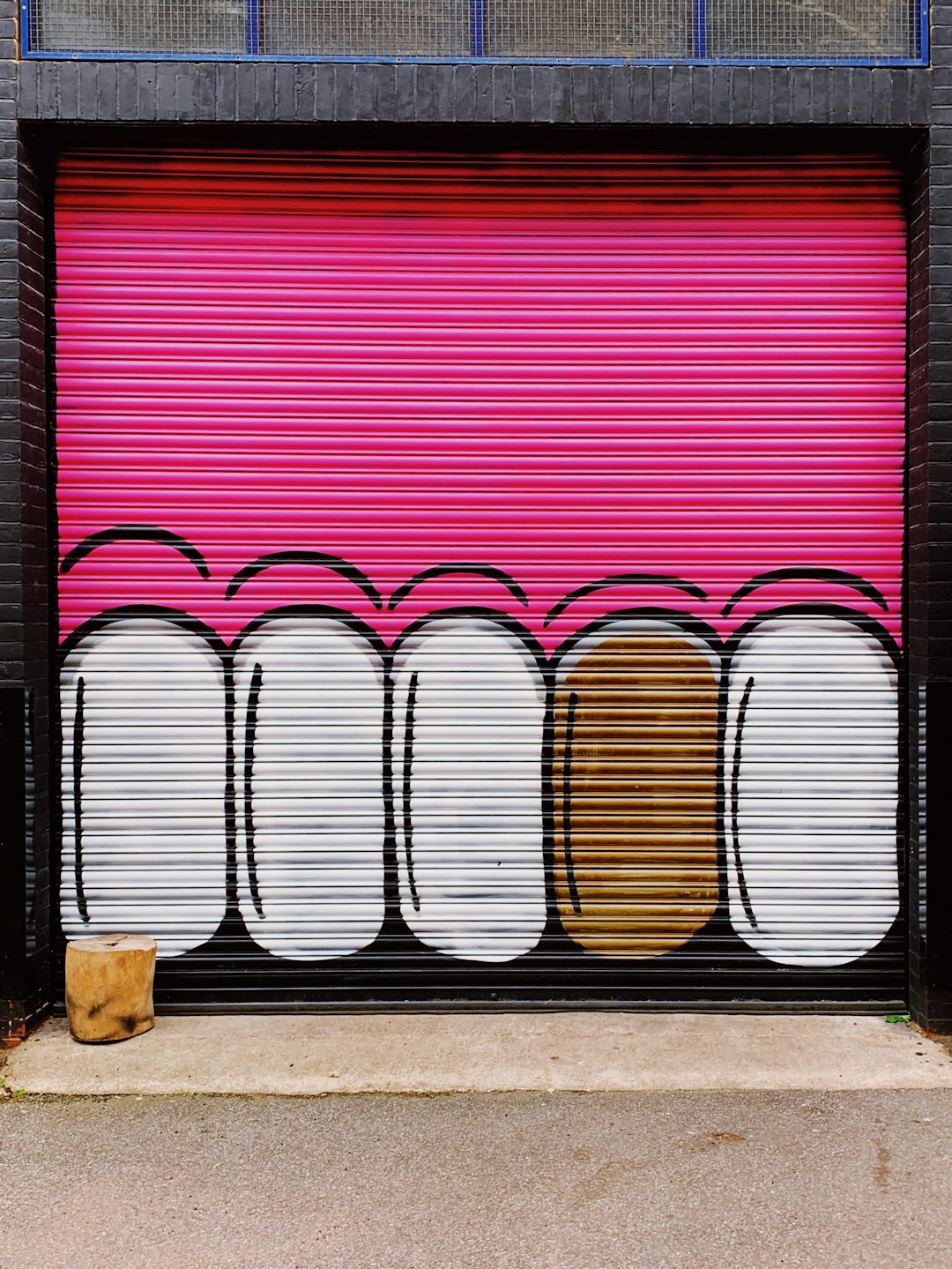 pink and white metal roll-up door
