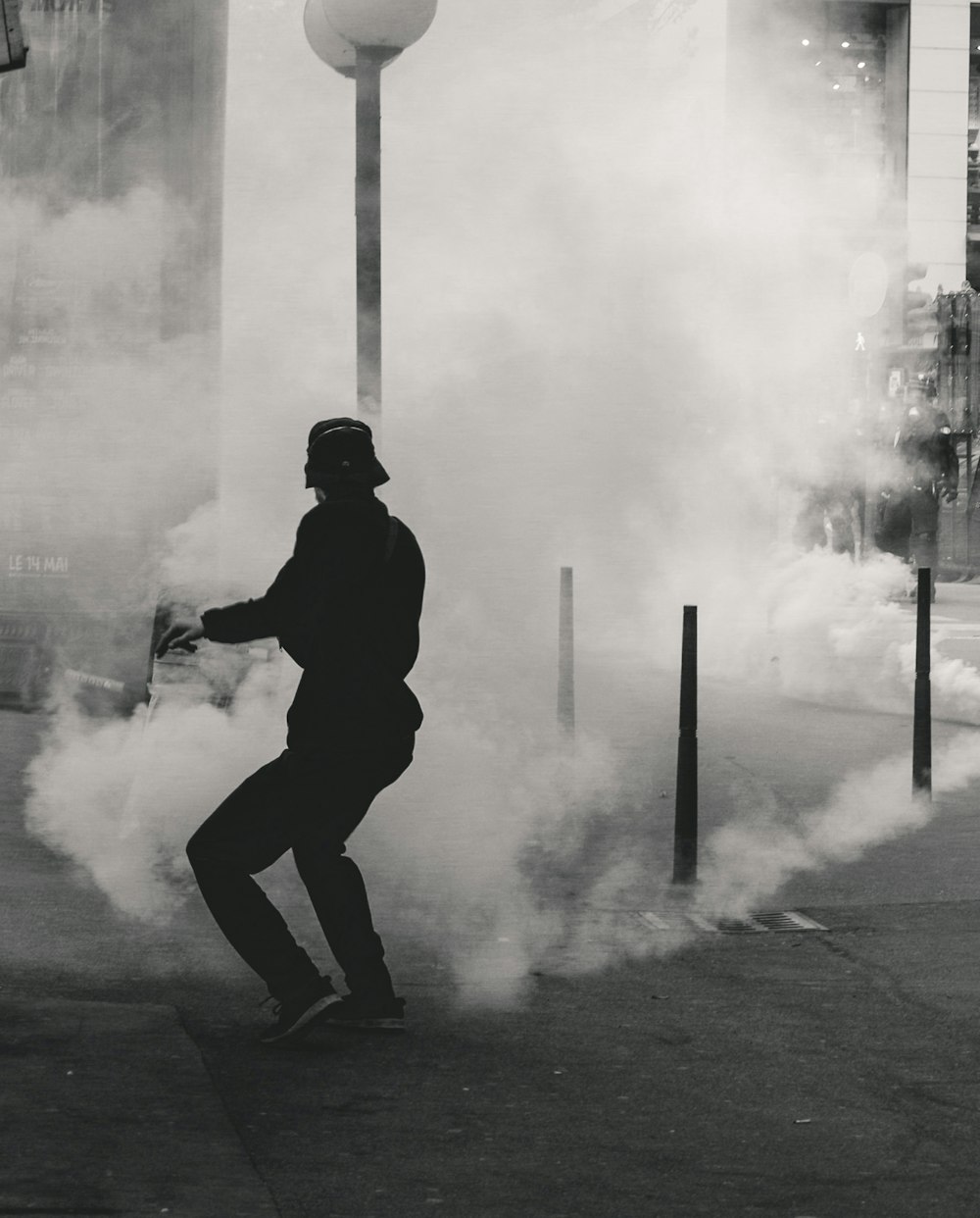 man standing near smoke