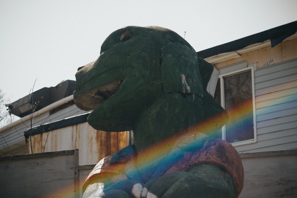 green dinosaur statue