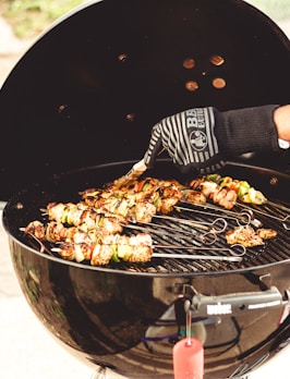 person grilling food