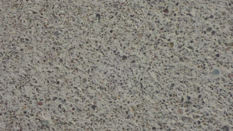 Close-up of stamped concrete with intricate patterns and natural stone look.