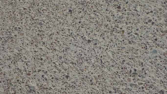 Close-up photo of handcrafted concrete products with soft natural lighting highlighting their texture.