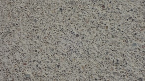 Close-up of decorative stamped concrete patio with intricate patterns.