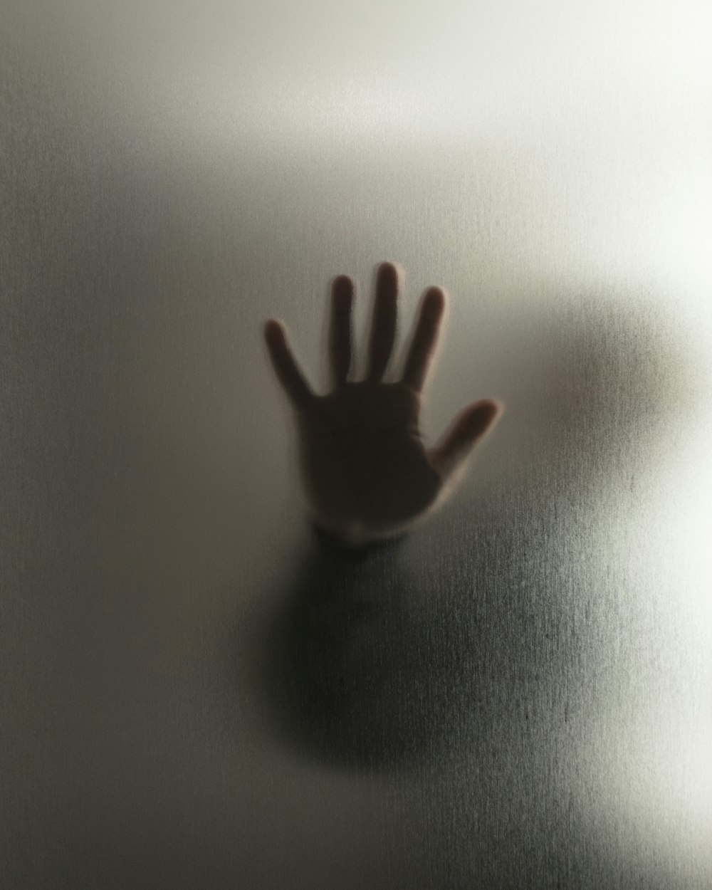 human hand on glass