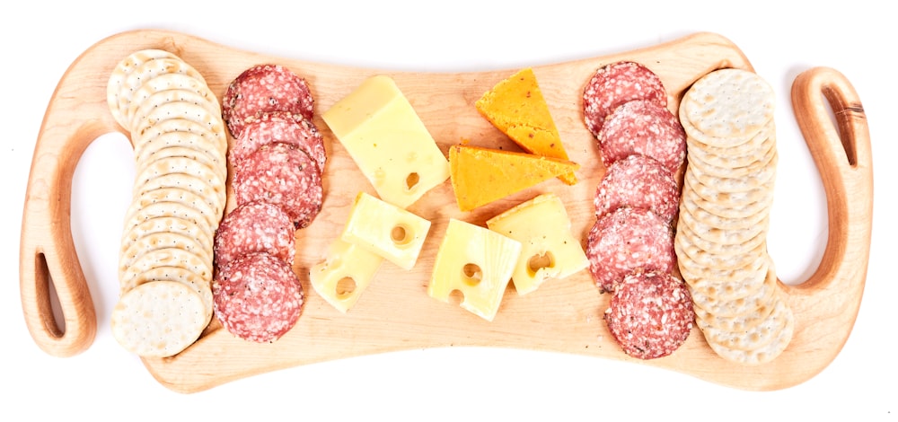 sliced foods in wooden chopping board