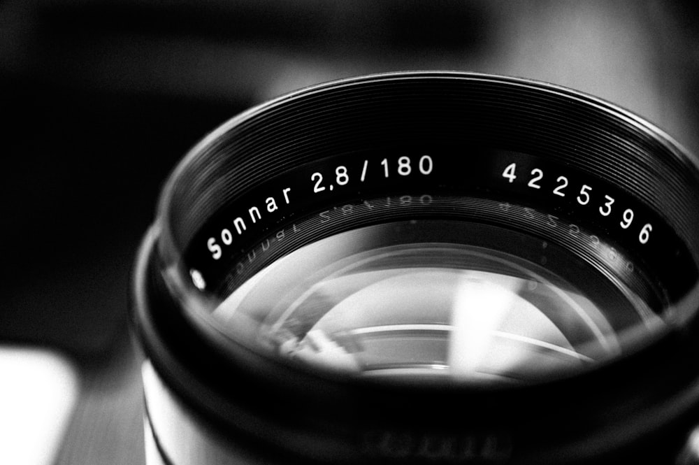 grayscale photography of camera lens