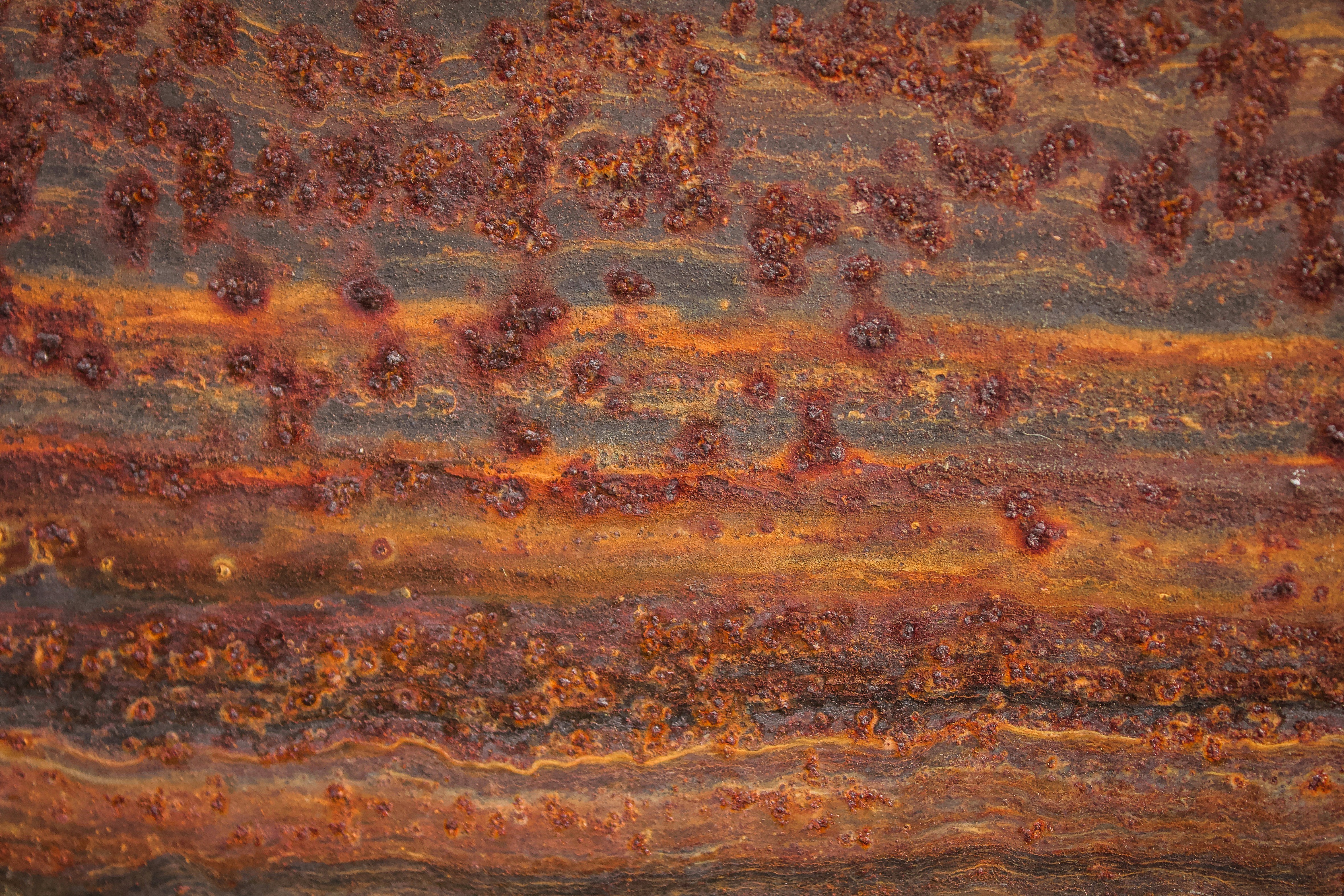 a close up of a rusted metal surface