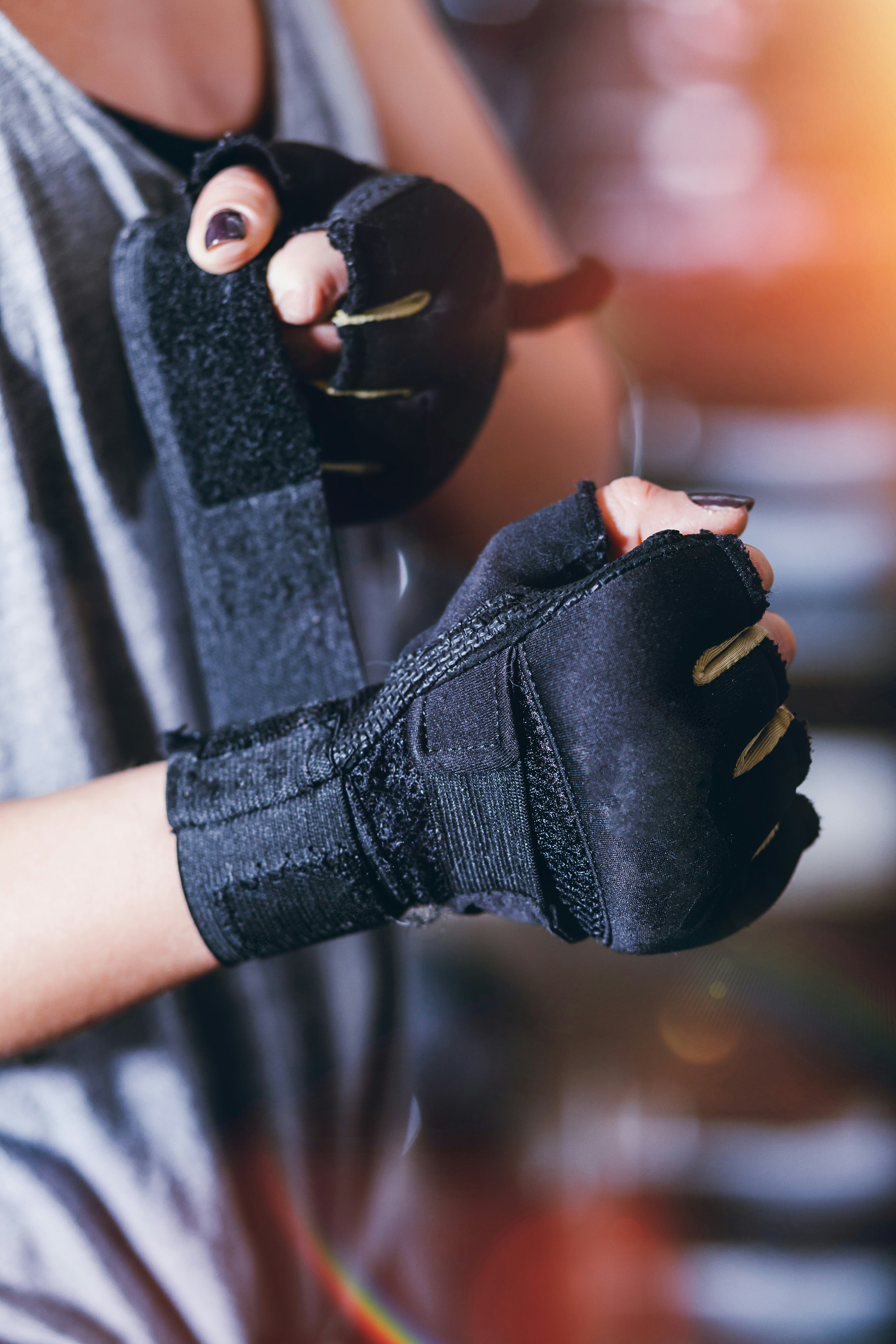 person wearing black fingerless gloves