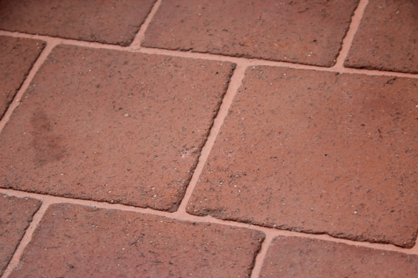 Close-up of a technical grid layout with terracotta and slate blue accents highlighting construction details
