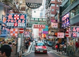 A vibrant street scene showcasing urban life in Hong Kong.