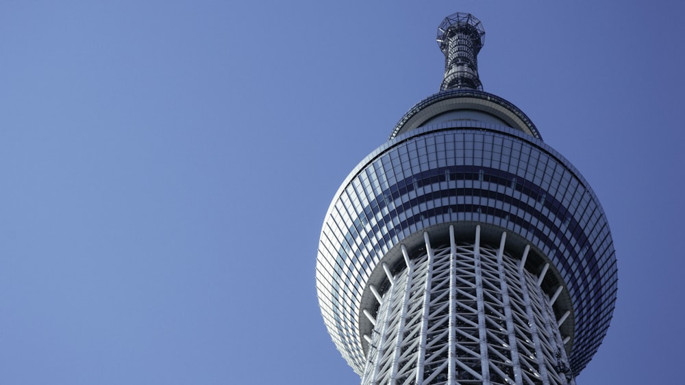 white and blue tower during daytime low-angle photography