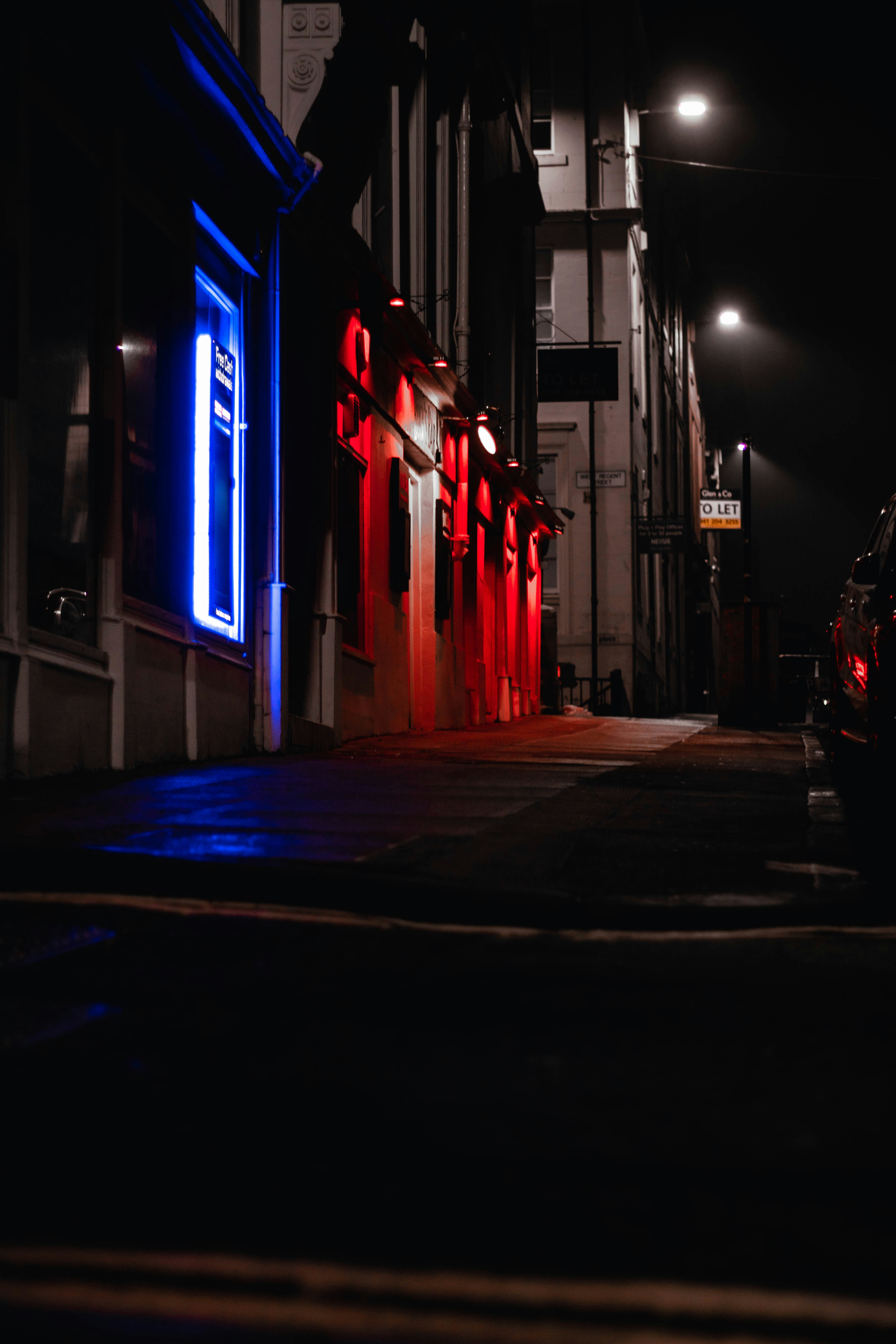 Red And Blue Neon Light On Building During Night Time Photo Free Lighting Image On Unsplash