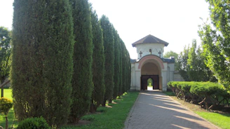 Elegant pathway lined with gold-accented markers leading through the investment site.