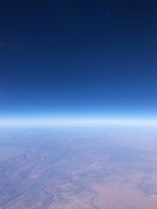 A panoramic view of Northeastern Somalia's diverse landscape under a bright blue sky.