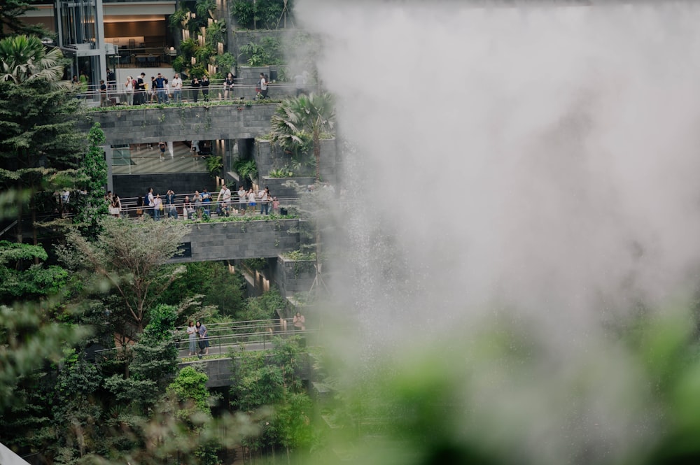 a group of people standing on top of a waterfall