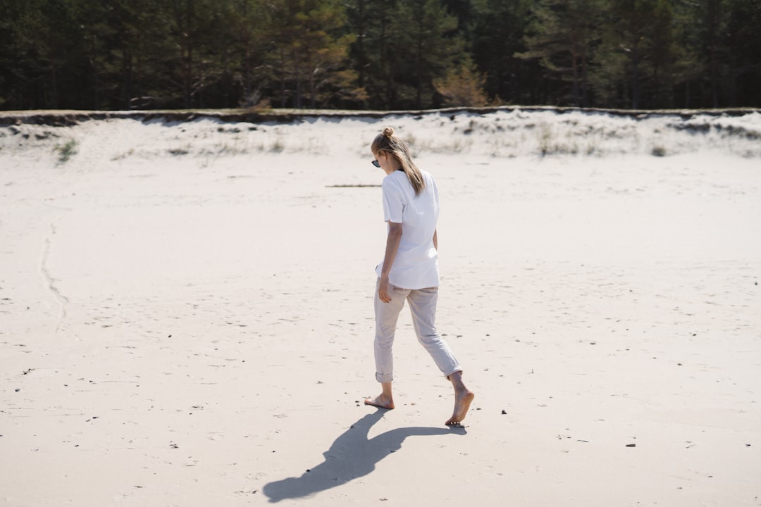 woman walking on ocean