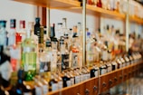 close-up photo of liquor bottles in rack