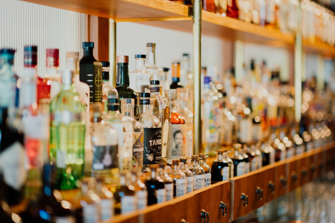 close-up photo of liquor bottles in rack,