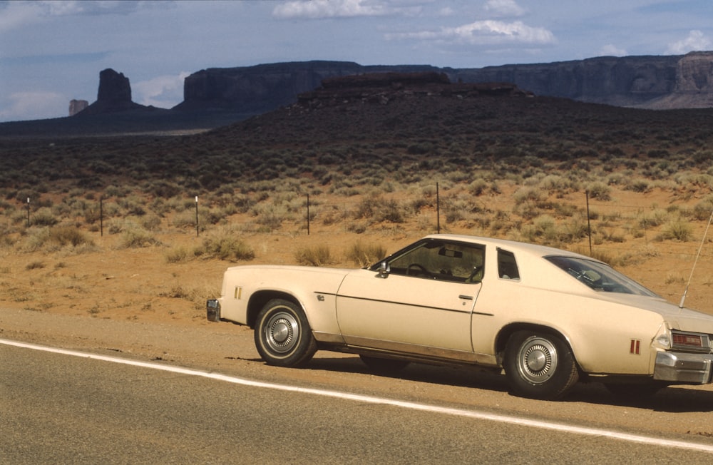 white muscle car on road