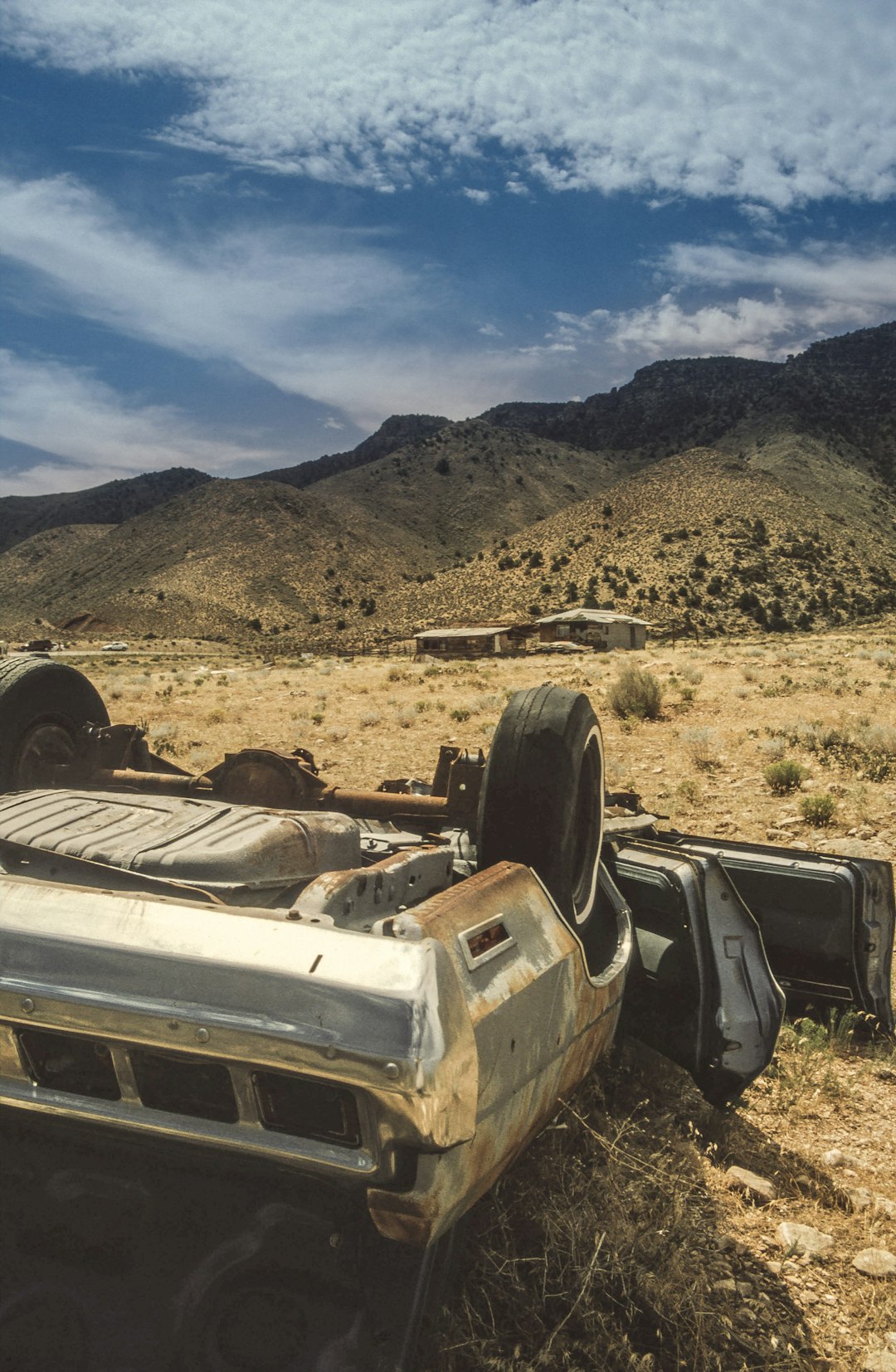 abandoned car on sand