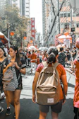 Vibrant street market scene in Guangzhou bustling with colorful stalls and local shoppers.