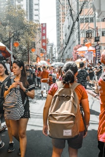 Bustling street scene in Chinatown with colorful lanterns and local market stalls