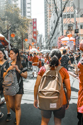 Vibrant street market scene in Guangzhou bustling with colorful stalls and local shoppers.