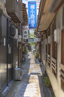 A quiet alleyway lined with traditional wooden houses in Kanazawa.