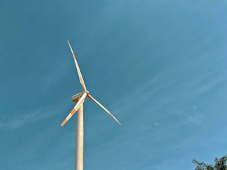 white windmill under blue sky