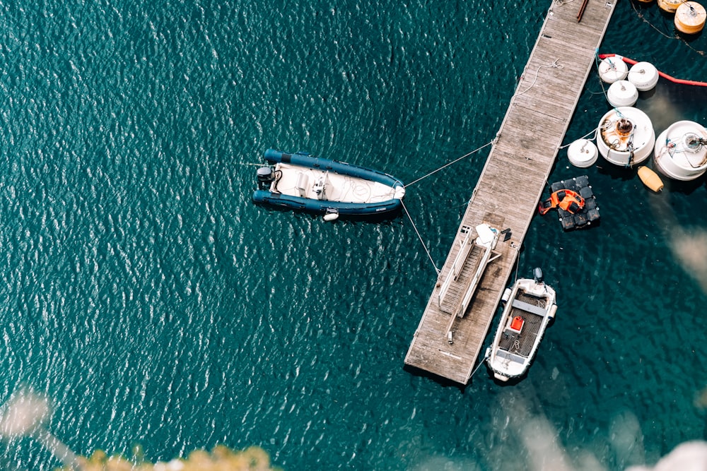 aerial photography of boat parked in front of dock