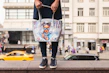 Close-up of a custom-printed tote bag featuring a playful design in bright colors.