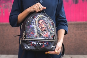 A close-up of a stylish backpack with artistic patterns.