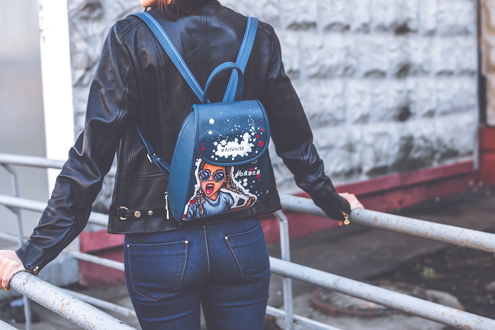 selective focus photography of woman carrying backpack