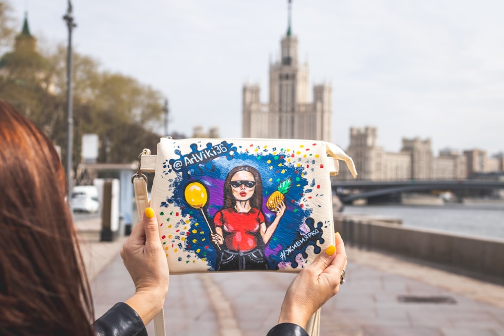 woman holding pineapple and balloon theme bag